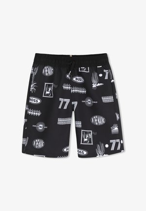 Zwarte shorts met witte grafische prints waaronder "BOSS", "Explore the World", "In the Making", nummer "77" en motieven van cactus en postzegel.