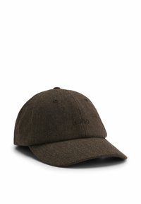 Herringbone-patterned brown cap with a curved brim and embroidered logo on the front. Fabric appears textured and woven.