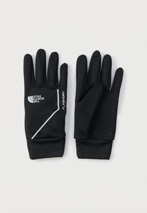 Mustad pika teksuurse kangaga kindad, mis sobivad tihedalt. Peal on valge logo ja tekst "FLASHDRY" ning soonikkoes varrukapitsid.