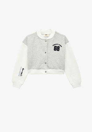 Cropped sweatshirt in grey and white. Soft material with button closures, featuring navy embroidery for "Legendary Leader 68" and text on sleeve.