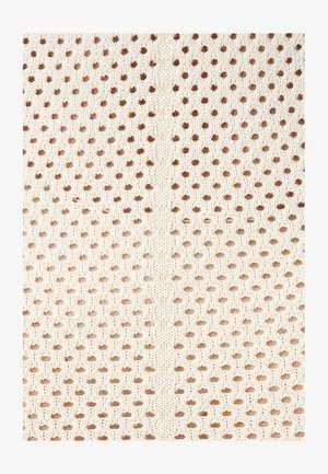 Kootud kangas meekoobaste mustriga heleda valge ja helepruuni tooni. Tekstureeritud pind, millel on ühtlaselt jaotatud augud ja keskmine õmblus.