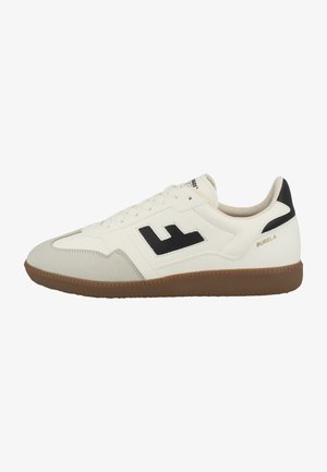 White sneaker with black accents, suede and synthetic upper, rounded toe, flat rubber sole with textured grip, and logo detail on the side.