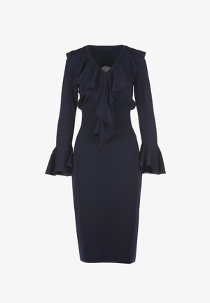 Navy long-sleeve dress in a fitted design with ruffled details at the neckline and sleeves, featuring a ribbed waistline.
