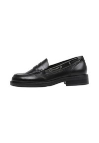 Mocasines de cuero negro con punta redonda, costura decorativa y cordones laterales. Presentan un tacón bajo y una textura suave.