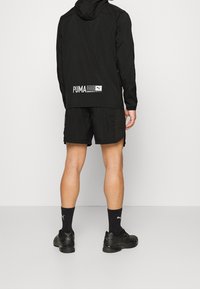 Puma Laufjacke - black