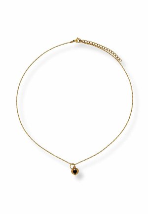 Delicate gold chain necklace with a small black heart-shaped pendant featuring a textured gold border.