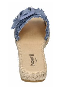 Denim espadrille sandal with frayed edges, light blue color, large decorative buckle, braided jute sole, and a smooth beige interior.