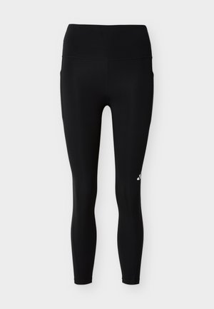 Μαύρα αθλητικά κολάν με ψηλή μέση, πλαϊνές τσέπες και ένα μικρό λευκό λογότυπο στο πάνω αριστερό μηρό, παρουσιάζονται σε απλό φόντο.