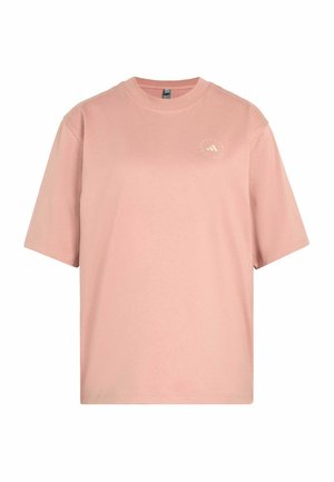 Miękka różowa koszulka z krótkim rękawem i okrągłym dekoltem, z małym okrągłym logo na lewej piersi.