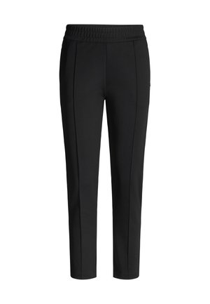 Schwarze, zulaufende Jogginghosen mit einem strukturierten Bund, die vorne zwei vertikale Nähte als dekoratives Detail aufweisen. Hergestellt aus einem weichen Stoff.