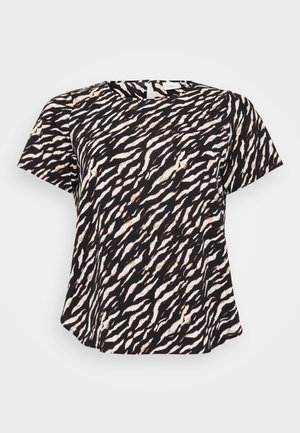 Top de manga curta em preto e branco com um padrão de listras de tigre onduladas. Tecido macio com um corte solto e decote redondo.