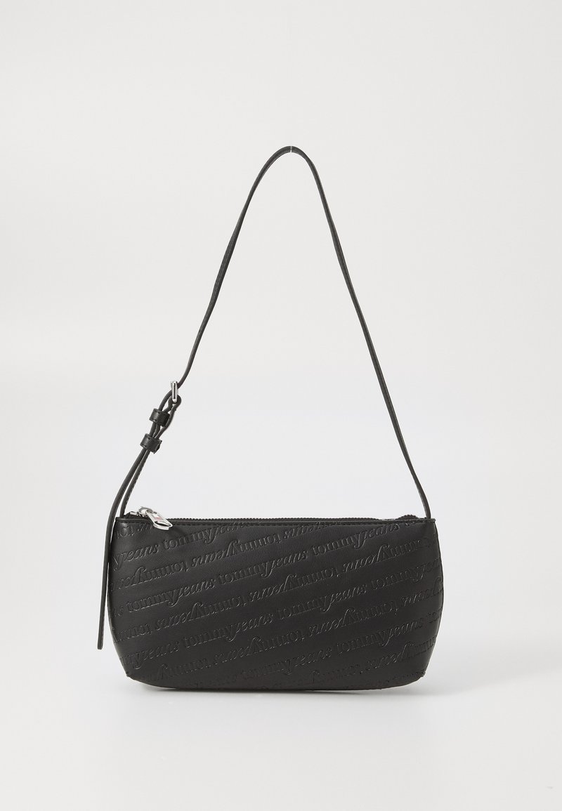 Black handbag in synthetic material, featuring embossed logo design. It has a rounded shape, slim profile, and an adjustable strap.