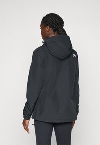 Black lightweight jacket with a hood, elastic cuffs, and drawstring hem. Features a geometric logo on the back left shoulder.