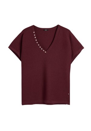 Burgundowy top z dekoltem w serek i krótkimi rękawami, z srebrnymi guzikami na dekolcie, wykonany z miękkiej dzianiny o gładkiej fakturze.