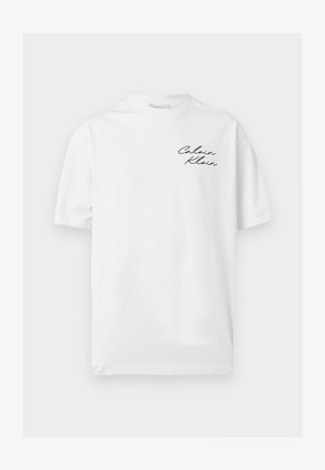 White short-sleeve crew neck T-shirt with "Calvin Klein" written in black script on the left chest.