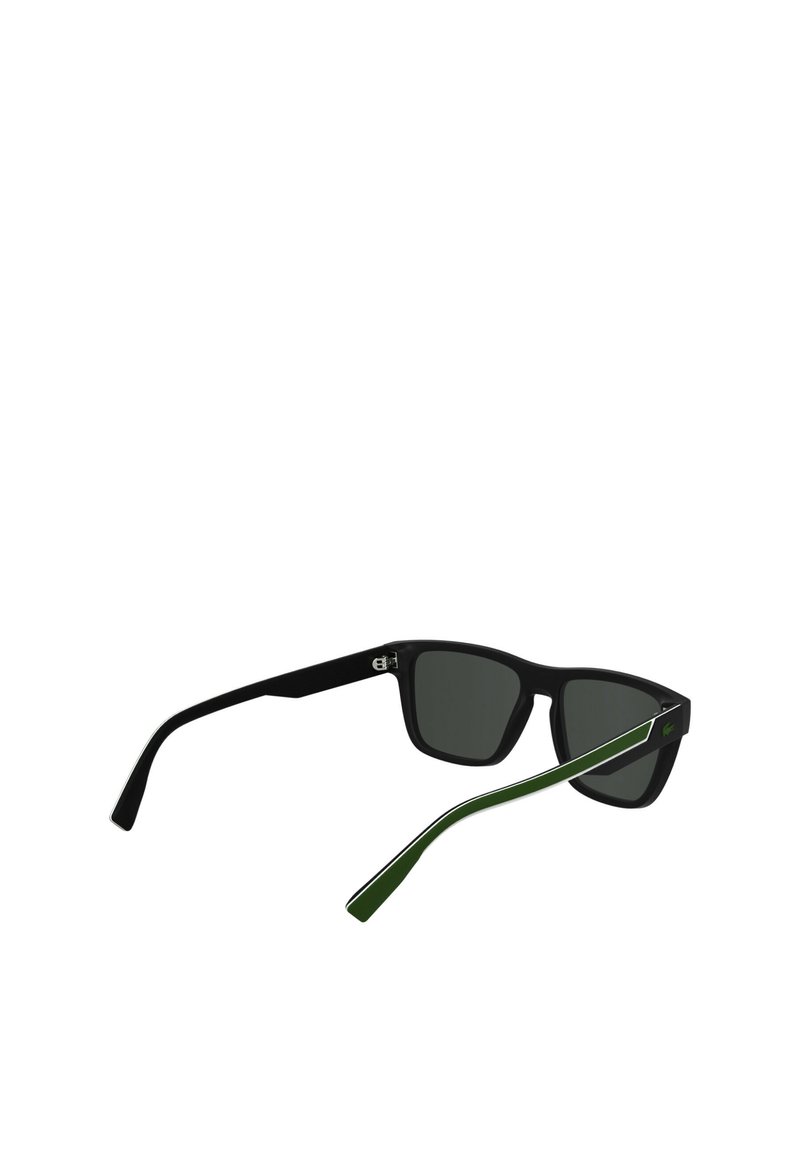 Black sunglasses with green-accented arms, square frame design, dark lenses, and logo detail on the temple. Matte finish and sturdy structure.