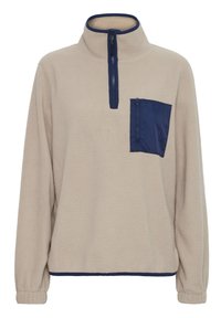 Beige fleece pullover med navy blå halvlukning, navy blå lynlåslomme på brystet og elastiske manchetter og kantbånd.