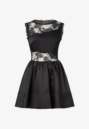 Czarna sukienka z dopasowanym gorsetem z satyny, z koronkową nakładką i falistymi krawędziami. Rozkloszowana spódnica ma gładką fakturę i marszczenia.