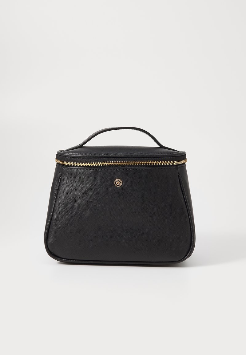 Black cosmetic bag with a textured finish, gold zipper closure, and top handle. Features a round logo on the front. Compact and structured design.