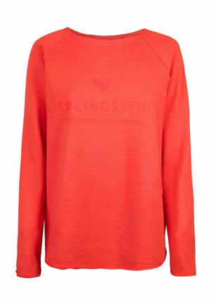 Langarm-Sweatshirt mit Rundhalsausschnitt in leuchtendem Korallrot, mit strukturiertem Stoff und einem dezenten Herz-Logo, darunter steht "LIEBLINGSSSTÜCK".