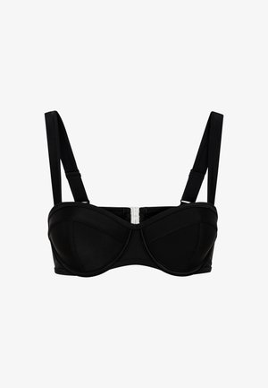 Melnā krūštura struktūrēts dizains ar bezšuvju apdari, platām siksnām un sudraba klipsi centrā. Gluda tekstūra.