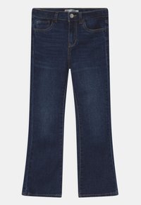 Jeans acampanados de color azul oscuro en una mezcla de algodón, que presentan cinco bolsillos, un cierre frontal de botón y costuras en contraste a lo largo de las costuras.