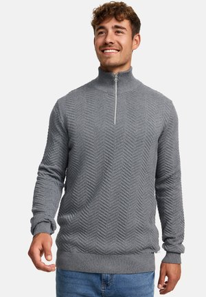 Gray zip-up sweater featuring a textured herringbone pattern, ribbed cuffs and hem, alongside a high collar and a contrasting zipper detail.