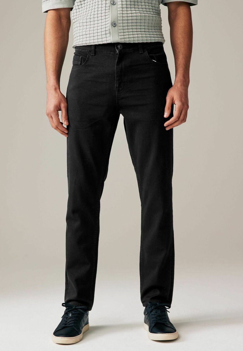 Next SUMMERWEIGHT COTTON - Jeans Tapered Fit - black