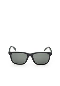 Lunettes de soleil rectangulaires noires avec verres teintés foncés et branches droites, positionnées face vers l'avant sur un fond blanc.