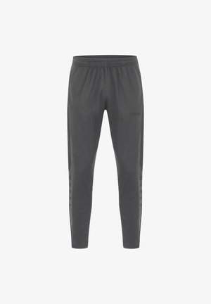 Graue Sporthose mit elastischem Bund, taillierter Passform, strukturiertem Stoff und seitlichen Details mit kleinen runden Akzenten. JAKO-Logo vorhanden.