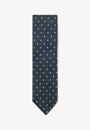 Navy tie with a textured fabric, featuring white and blue floral patterns and small dots distributed evenly throughout the design.