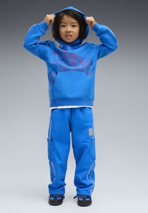 Puma, PUMA X TRANSFORMERS T7 RELAXED GRAPHIC HOODIE - Felpa con cappuccio - racing blue