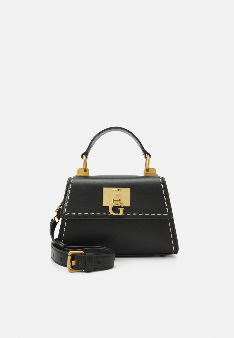 Sac à main en cuir noir avec fermoir doré et logo "G", surpiqûres blanches, poignée supérieure et bandoulière amovible avec boucle dorée.