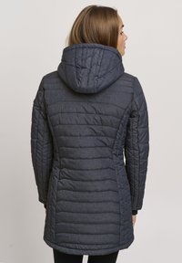 Dark blue padded jacket with a hood, featuring a quilted design, side seams, and elastic cuffs. Smooth texture with a modern silhouette.