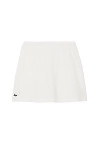Falda blanca de algodón con un diseño acampanado, cintura elástica y un pequeño logo verde de Lacoste en el lado izquierdo. Textura suave.