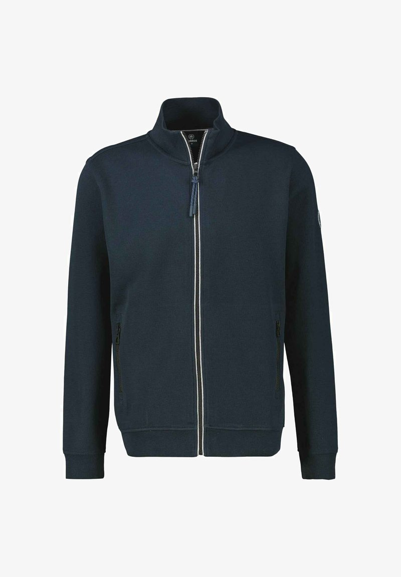Marinekleurige ritsjack met hoge kraag, twee zijzakken en een witte streep langs de rits; ribgebreide manchetten en zoom. Getextureerde stof.