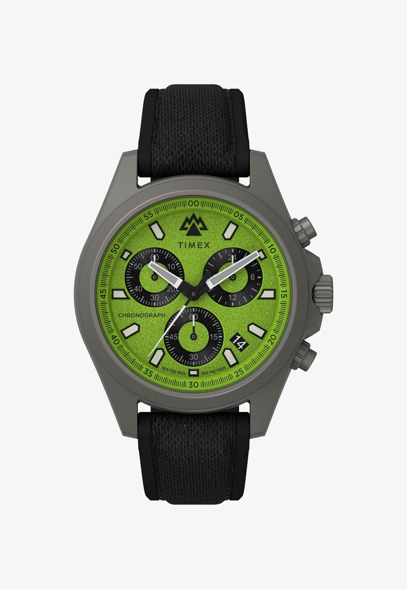 Timex chronografas su ryškiu žaliu tekstūruotu ciferblatu, juodais subciferblatais, pilku dėklu ir juodu audiniu dirželiu. Atsparus vandeniui iki 100 metrų.