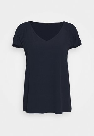 Blouse noire pour femme à manches courtes, col en V et manches légèrement froncées, présentée sur un fond blanc uni.