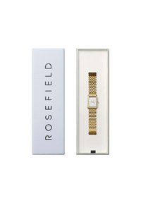 Montre avec un bracelet en maille dorée, dotée d'un boîtier rectangulaire et d'un cadran blanc, présentée dans une boîte blanche avec le logo "ROSEFIELD".