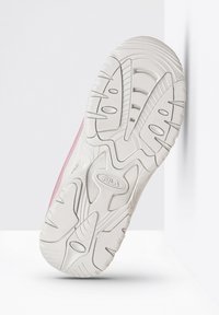 White rubber sneaker sole with textured grip pattern and pink accents along the sides. Features prominent Fila logo and stylized grooves.