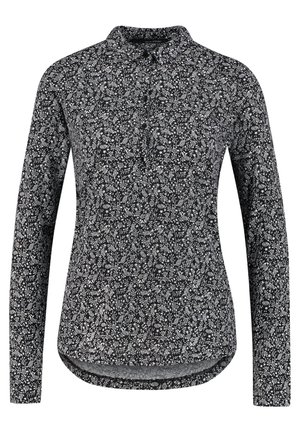 Musta pitkähihainen pusero, jossa pieni valkoinen kukkakuvio ja kaulus, edestä napitettu, hieman kaartuva helma.