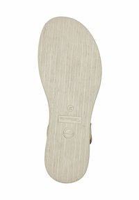 Helle beige Gummisohle mit einem strukturierten, gestreiften Muster. Verfügt über ein rundes Logo und eine Größenangabe. Glatte Kanten, ovale Form.