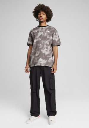 Puma STATEMENT PANTS - Pantalones cargo - black