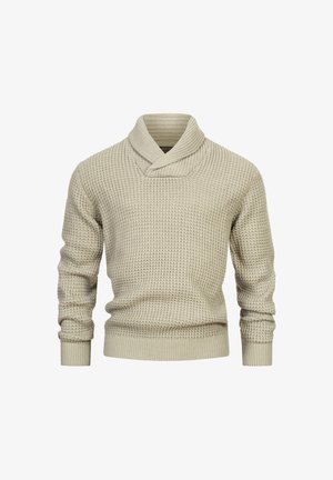 Jasno beżowy sweter dzianinowy z kołnierzem typu szal, teksturowanym wzorem, ściągaczami przy rękawach i w pasie. Wykonany z miękkiego, ciepłego materiału.