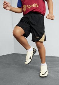 Nike Performance UNISEX - Pantalón corto de deporte - black/gold