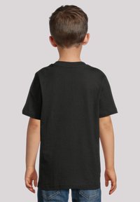 Black short-sleeved t-shirt made of soft fabric, featuring a classic crew neckline and a relaxed fit, with no visible graphics or patterns.
