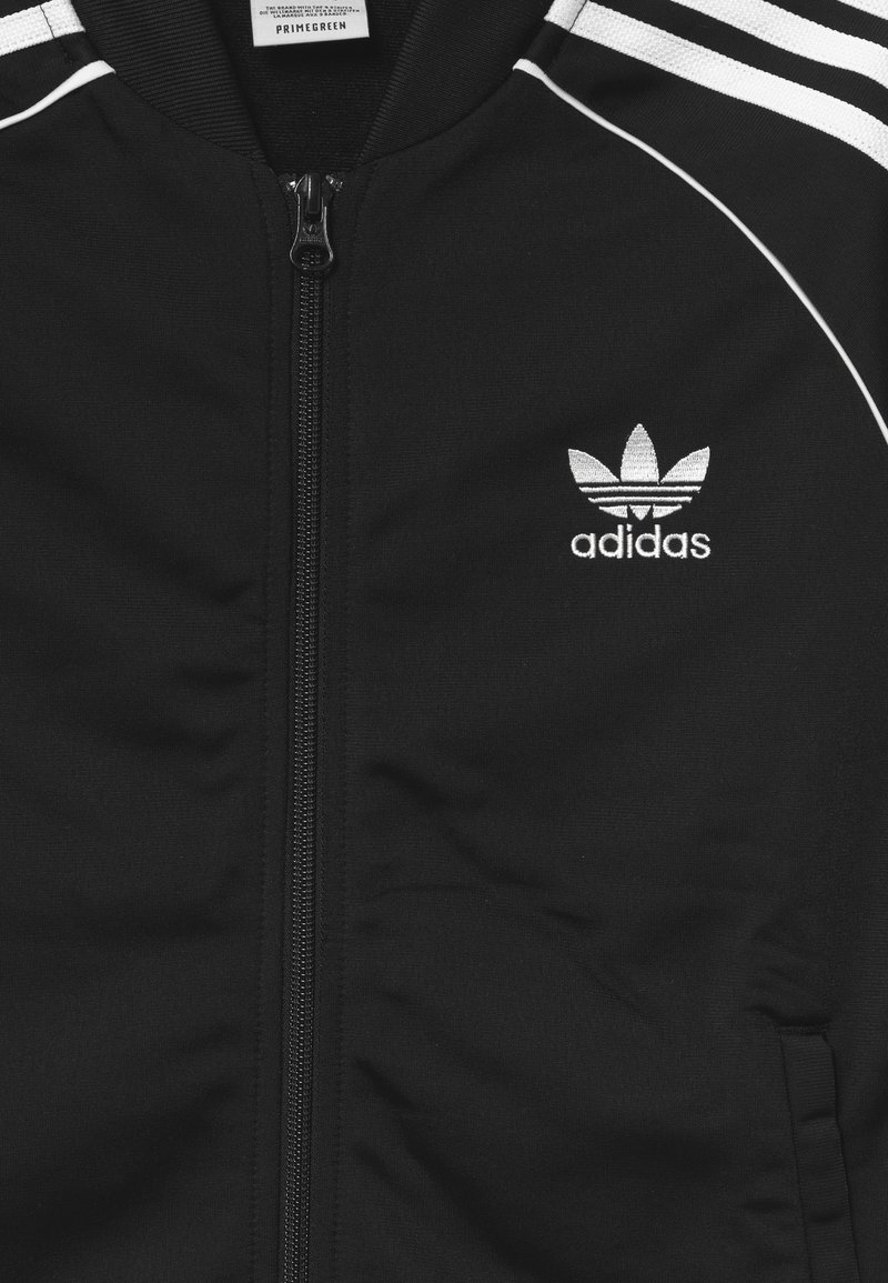 Punto de referencia físicamente Disponible adidas Originals TRACK UNISEX - Chaqueta de entretiempo - black/white/negro  - Zalando.es