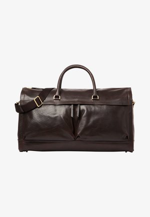 Dunkelbraune Leder-Duffel-Tasche mit doppelten Griffen, verstellbarem Schultergurt, vorderen Reißverschlusstaschen und Beschlägen in Goldfarbe.