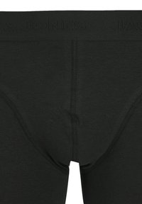 Schwarze Baumwollboxershorts mit glatter Textur, versehen mit einem Bund mit eingeprägtem Markennamen. Keine sichtbaren Muster oder Akzente.
