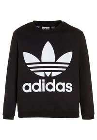 Černá mikina s dlouhým rukávem a velkým bílým logem Adidas trefoil s textem "adidas" umístěným na přední straně.